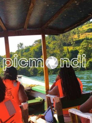 People on a boat, sailing on a lake, enjoying a beautiful landscape